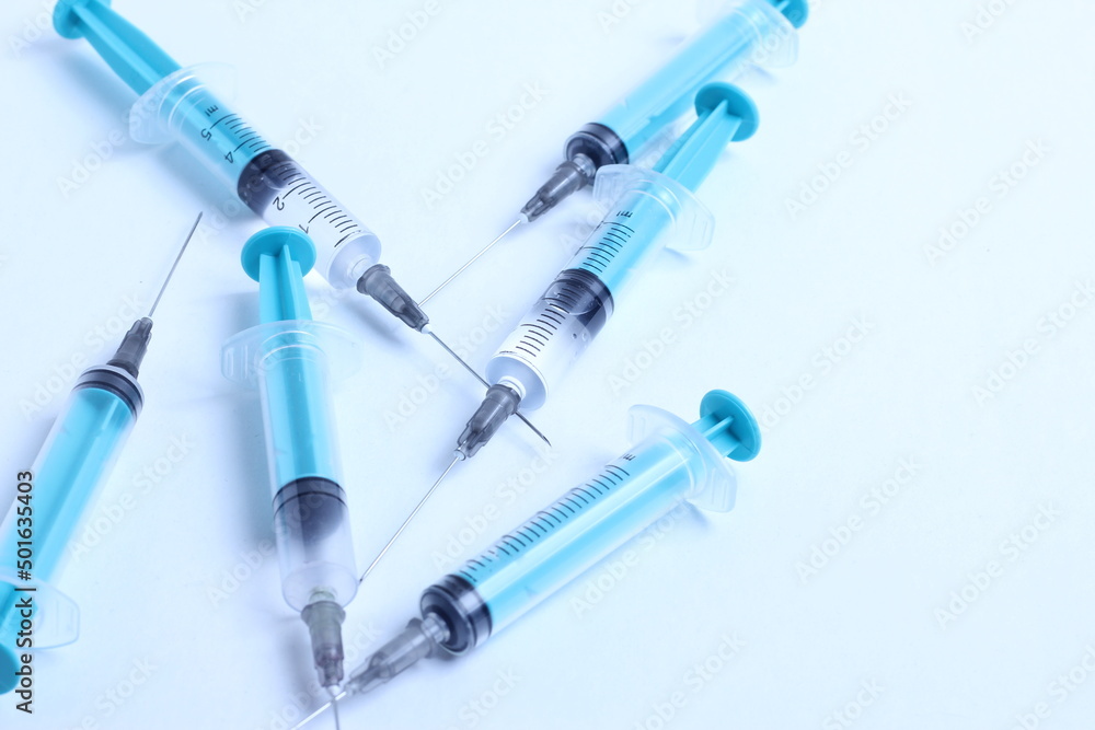 Medical syringe on a white background. A syringe for injection. The concept of health and beauty Medical syringe on a white background. A syringe for injection. The concept of health and beauty
