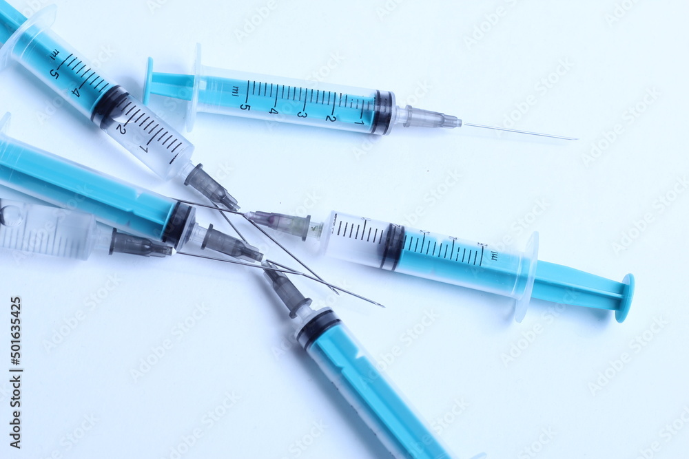 Medical syringe on a white background. A syringe for injection. The concept of health and beauty Medical syringe on a white background. A syringe for injection. The concept of health and beauty