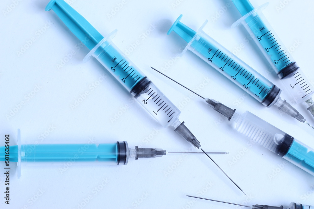 Medical syringe on a white background. A syringe for injection. The concept of health and beauty Medical syringe on a white background. A syringe for injection. The concept of health and beauty