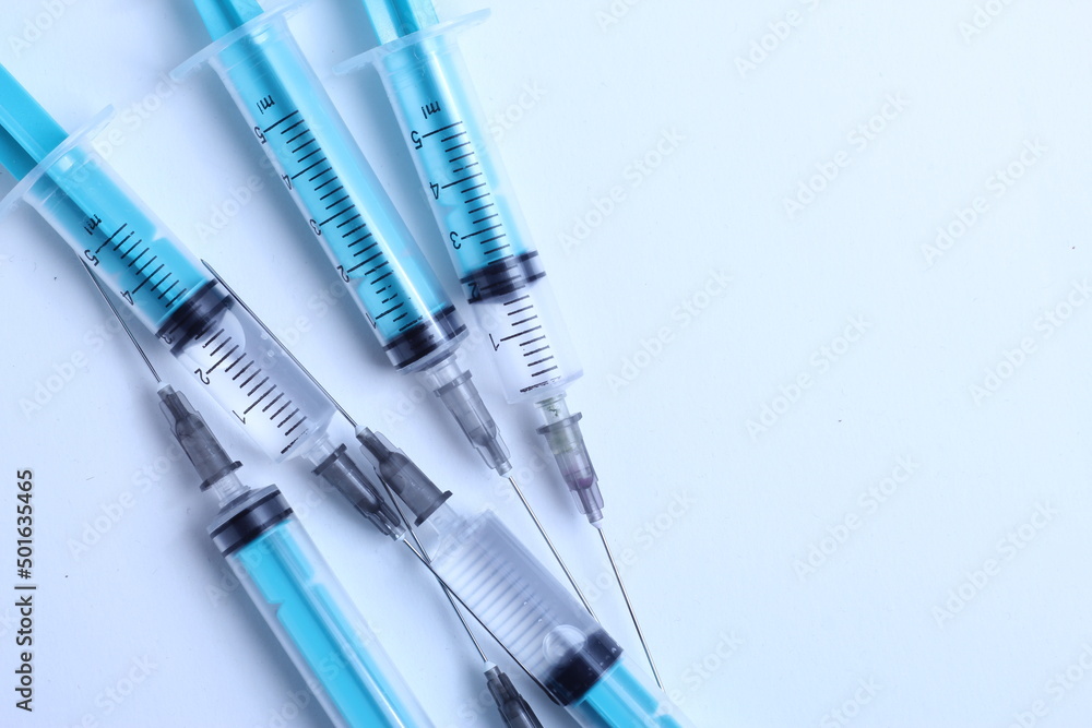 Medical syringe on a white background. A syringe for injection. The concept of health and beauty Medical syringe on a white background. A syringe for injection. The concept of health and beauty