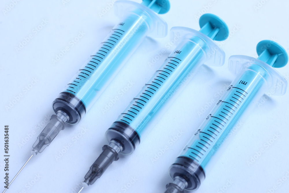 Medical syringe on a white background. A syringe for injection. The concept of health and beauty Medical syringe on a white background. A syringe for injection. The concept of health and beauty