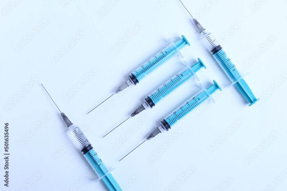Medical syringe on a white background. A syringe for injection. The concept of health and beauty Medical syringe on a white background. A syringe for injection. The concept of health and beauty