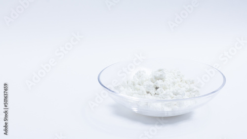 cottage cheese in a glass transparent bowl isolated on a white background