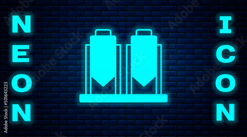 Glowing neon Traditional brewing vessels in brewery icon isolated on brick wall background. Beer brewing process. Distillery plant, brewery. Vector