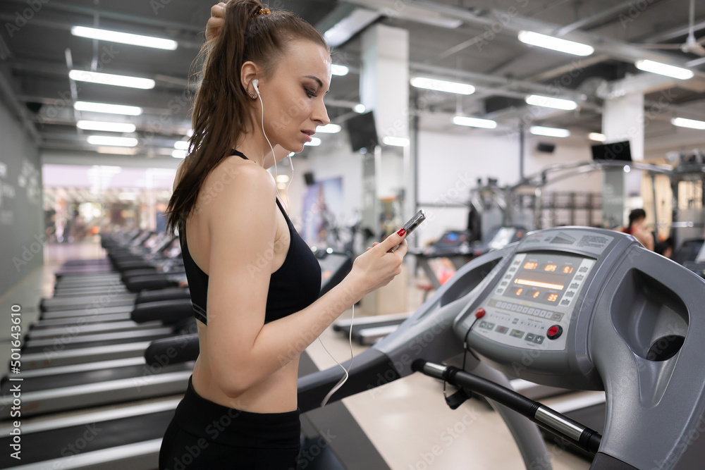 Adult woman running on treadmill