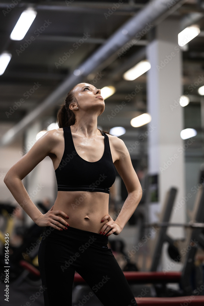 Fit woman exercising building muscles Fit woman exercising building muscles