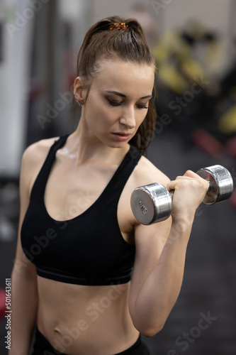 Fit woman exercising building muscles
