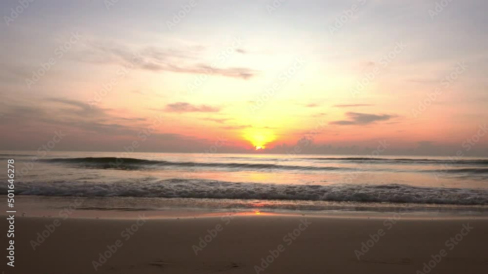 Tropical golden sunrise over ocean water reflection on seascape. No-people sand beach at sea bay, Summer morning vacation holiday. Tropical golden sunrise over ocean water reflection on seascape. No-people sand beach at sea bay, Summer morning vacation holiday.