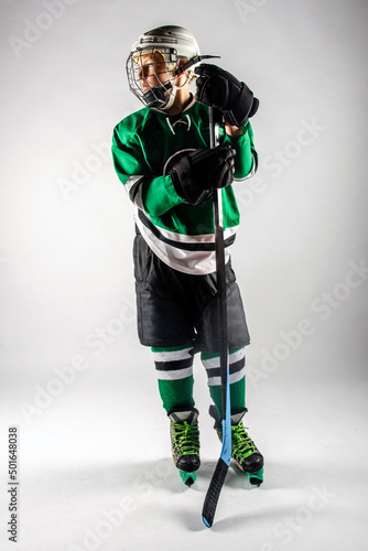 Photography Male youth hockey player in full gear standing on the ice
