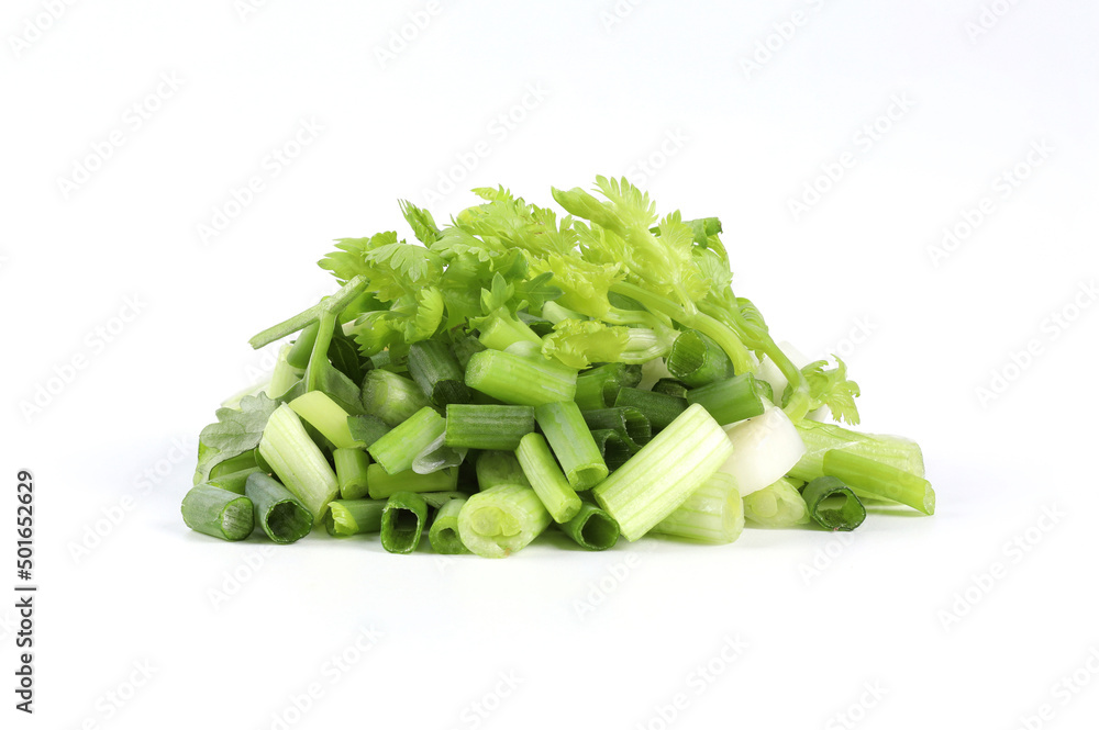 Fresh green coriander and spring onions cut into small pieces. Put together on a white background . It is a fragrant edible herb. Can be used for cooking and decorating food, can be eaten raw Fresh green coriander and spring onions cut into small pieces. Put together on a white background . It is a fragrant edible herb. Can be used for cooking and decorating food, can be eaten raw