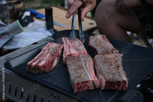 meat on the grill outdoors. Bbq dinner while camping in korea.