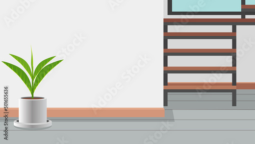 Background of interior design inside house with tree pot on the floor. Steel stairway leading upstairs is on the side. and the empty space of the wall in the middle of the house.