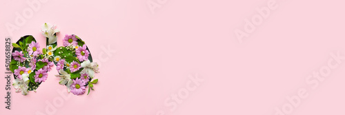Slika na platnu Lungs made of fresh flowers on pink background with space for text