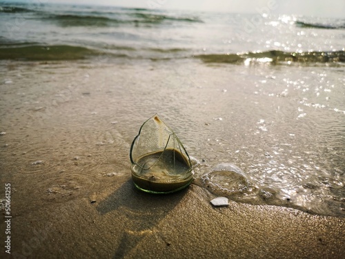 broken glass on beach may be danger to people