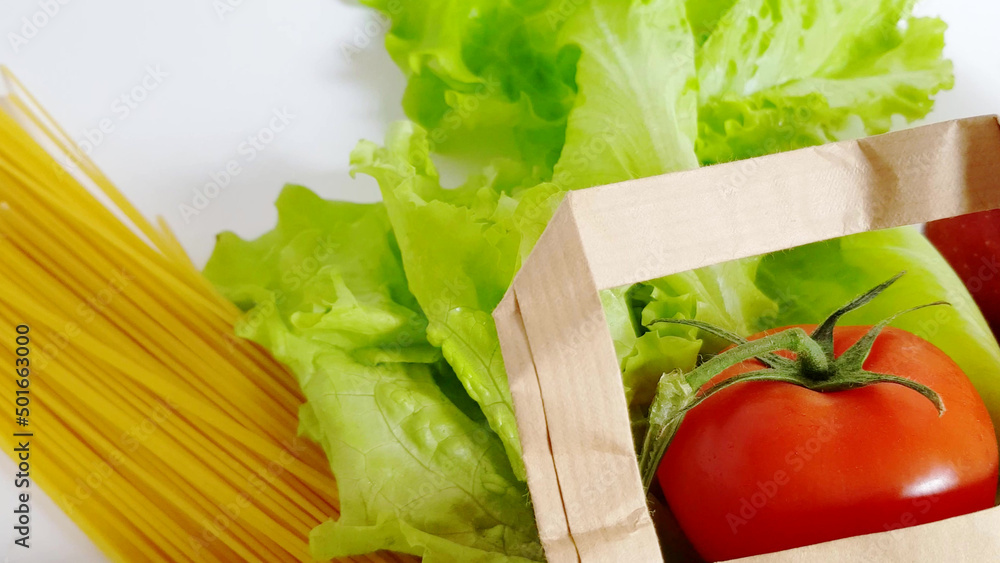 Food delivery - fresh vegetables, fruit, pasta in a paper bag, zero waste concept, online shopping, quarantine Food delivery - fresh vegetables, fruit, pasta in a paper bag, zero waste concept, online shopping, quarantine