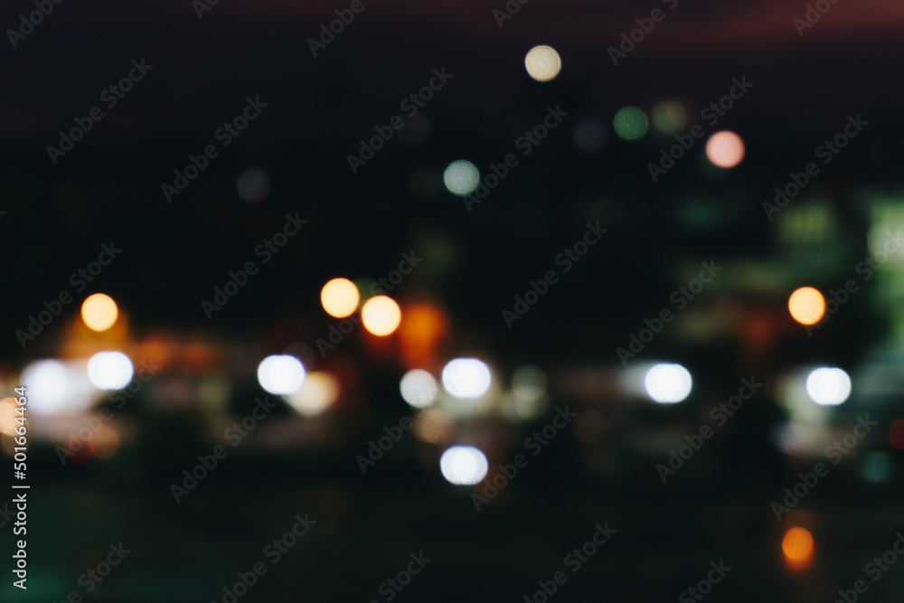 Abstract blurred bokeh city at night with sky and road light