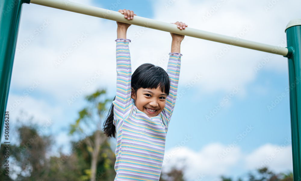 girls exercising in the playground. girls exercising in the playground.