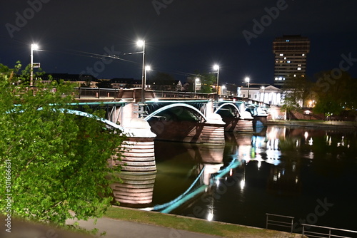 Frankfurt am Main at night with a view of the illuminated Ignatz Bubis Bridge, Frankfurt, Hesse, Germany photo