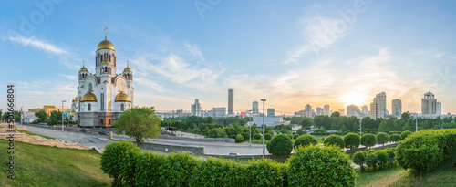 Panorama of spring or summer Yekaterinburg and Temple on Blood in orange sunset light. Yekaterinburg, Russia