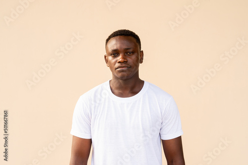 Portrait of handsome African man wearing white t-shirt