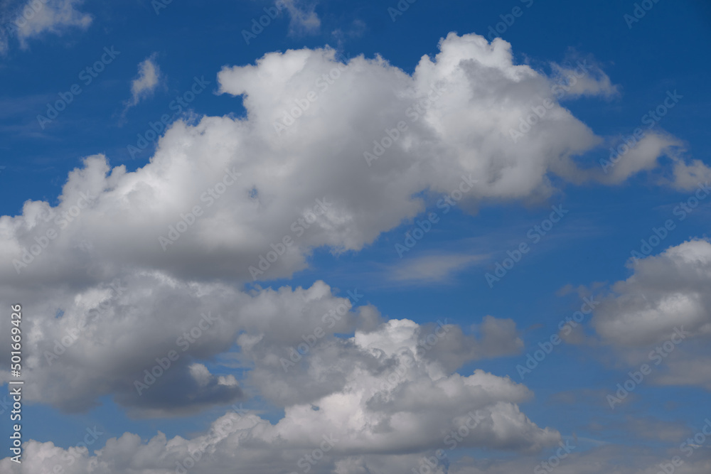 Cumulus clouds on the blue sky. Beautiful clouds. Cloudiness in the blue sky in clear weather. Cloudy on blue. Cumulus clouds on the blue sky. Beautiful clouds. Cloudiness in the blue sky in clear weather. Cloudy on blue.