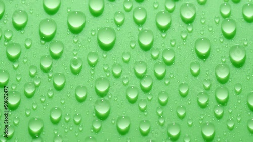 Wallpaper Mural Close-up transparent water drops texture rotating on green chroma key background Torontodigital.ca