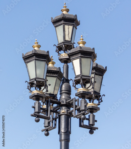 Lantern on a metal pole in the city during