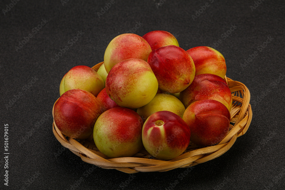 Sweet small nectarines in the basket Sweet small nectarines in the basket