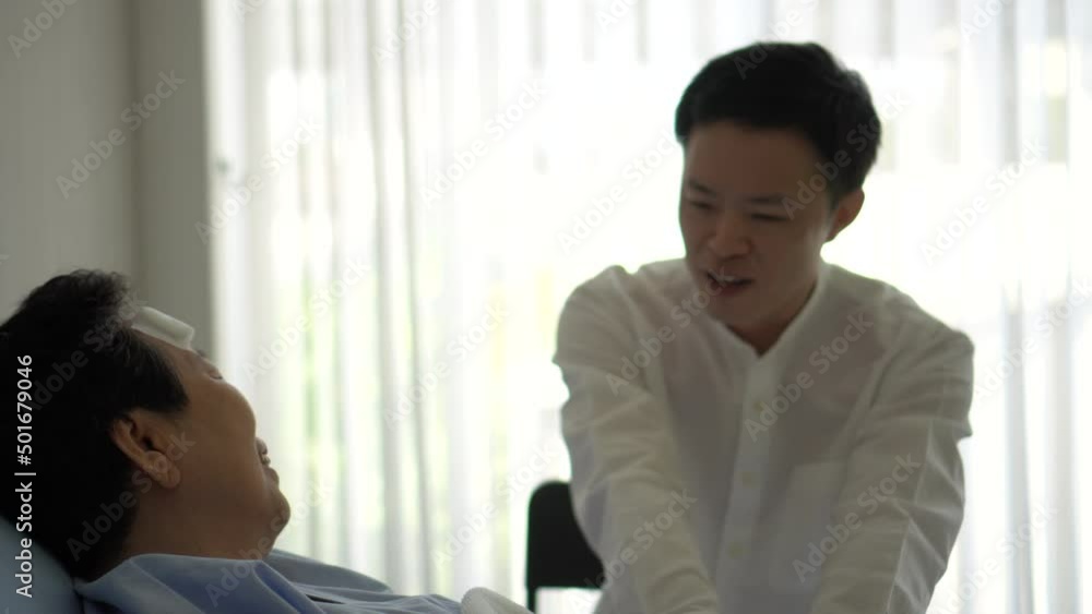 Adult son visiting old mother at hospital with positive energy talk laugh and smile Adult son visiting old mother at hospital with positive energy talk laugh and smile