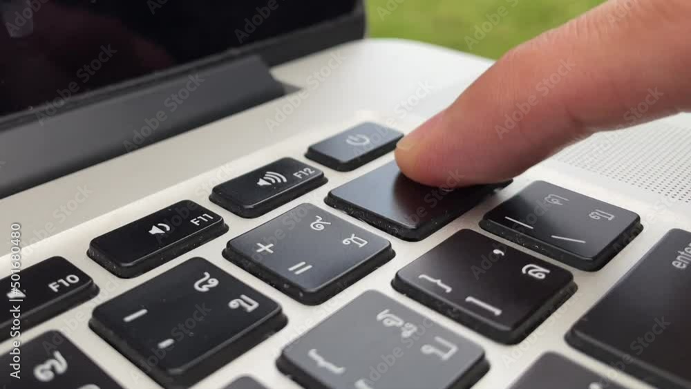 Typing on keyboard. Male hand finger press Typing on keyboard. Male hand finger press