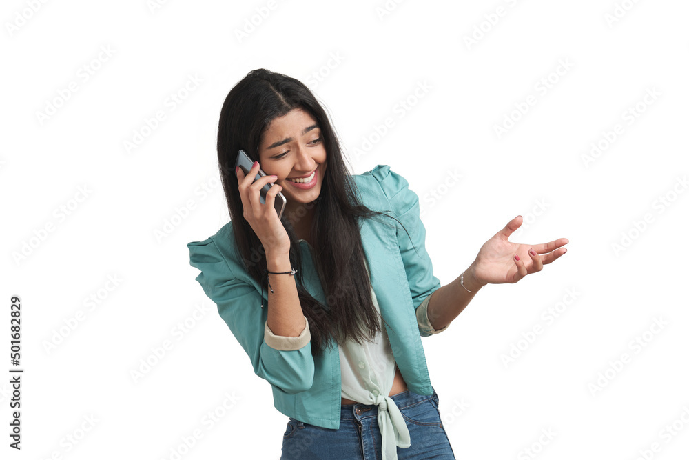 Young Venezuelan woman talking on the smartphone, laughing and shrugging. Isolated over white background. Young Venezuelan woman talking on the smartphone, laughing and shrugging. Isolated over white background.