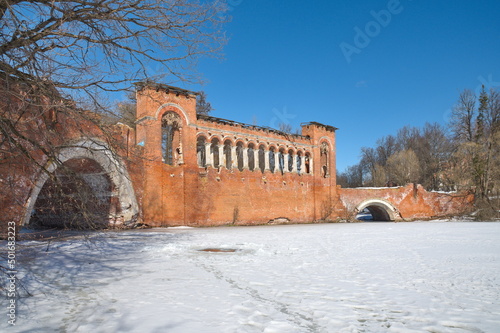 Marfino, Moscow Region, Russia - March 15, 2022: Shaped bridge in Gothic style in the Marfino estate photo