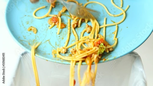 Man is throwing  away food waste to the bin, in studio Chiangmai Thailand.