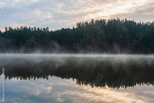 Misty lake at sunrise