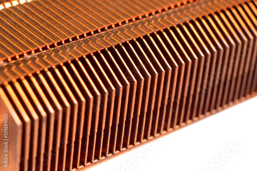 Macro shot heatsink on laptop motherboard. CPU heatsink cooler of the computer laptop. Thin cooling blades and metal radiator. Cooling fins of a computer cooling device