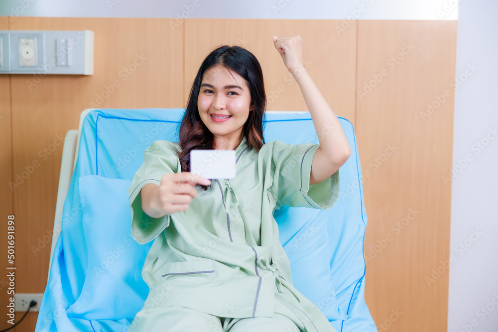 white card mockup in asian Beautiful woman patient hand sitting in hospital bed at medical center. white card mockup in asian Beautiful woman patient hand sitting in hospital bed at medical center.