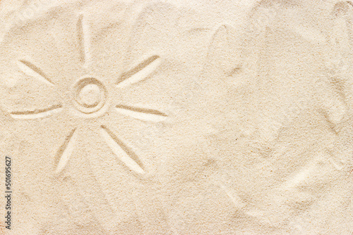 drawing of the sun on the sand close-up
