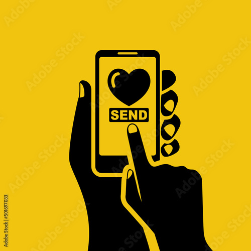 Send charity. Phone in hand. Send a heart. Vector illustration flat design. Isolated on white background. Press the button on the screen of the smartphone.