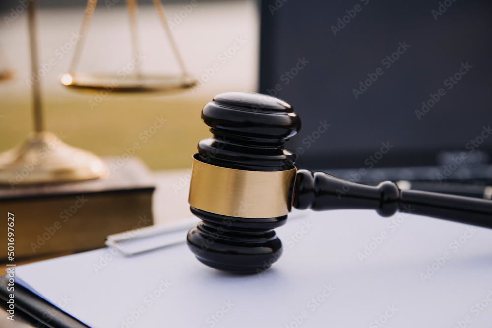 Judge gavel and legal book on wooden table, justice and law concept