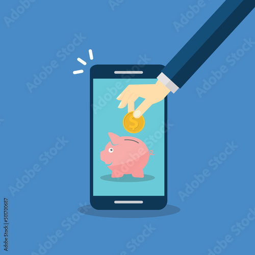 Donate, donation concept. Human hand with gold coin and piggy bank on mobile phone.