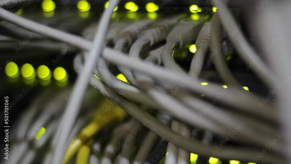 Working switch in data center. UTP cables, jacks, blinking led