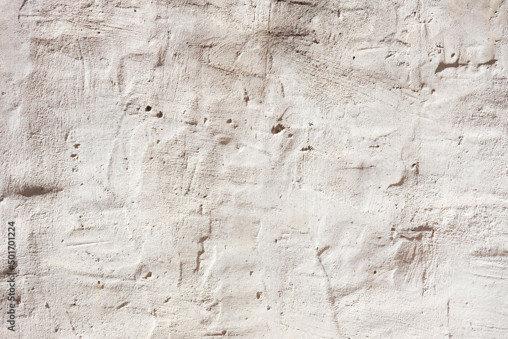 Background of a white plaster wall with imperfections in its texture. Background of a white plaster wall with imperfections in its texture.