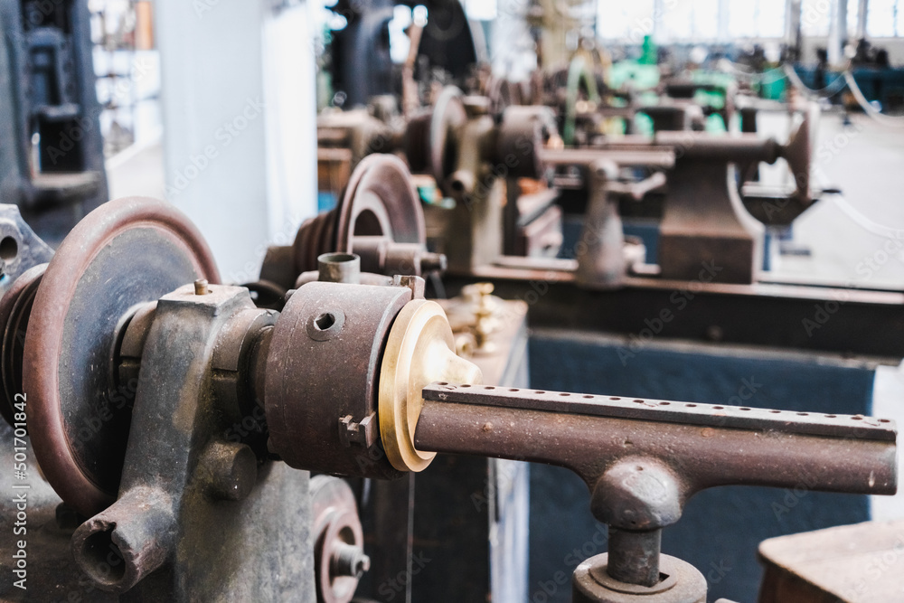 Interior of an old metalworking factory with metal lathes and presses. Interior of an old metalworking factory with metal lathes and presses.