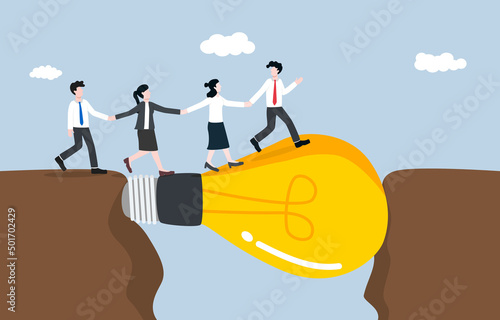 Idea or creative solution for helping team solve business project problem, brainstorming concept. Big light bulb idea posing as connecting bridge to support colleagues cross mountains gap.