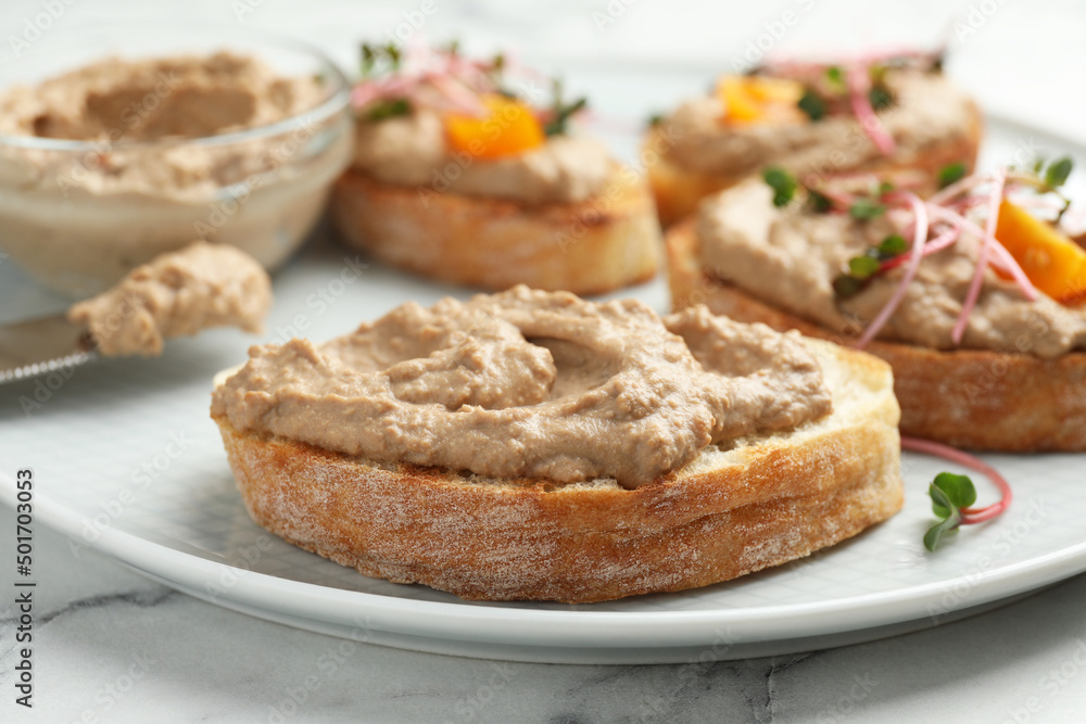 Slices of bread with delicious pate on white marble table, closeup Slices of bread with delicious pate on white marble table, closeup