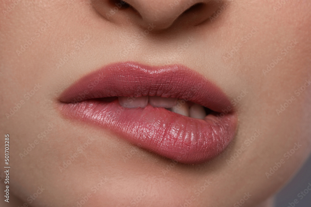 Fototapeta premium Young woman with beautiful plump lips, closeup