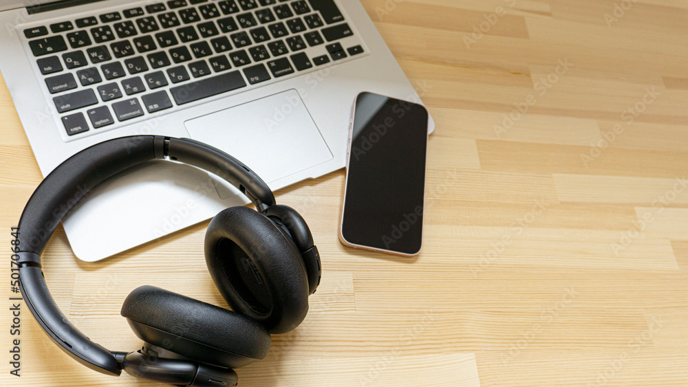 Laptop and headphones on the desk Laptop and headphones on the desk