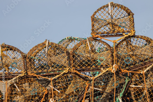 Crab pots or lobster creel stacked. Fishing industry background image