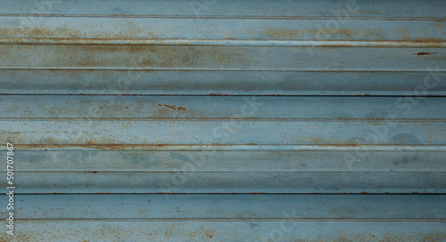 Blue and rust corrugated metal roofing panel texture
