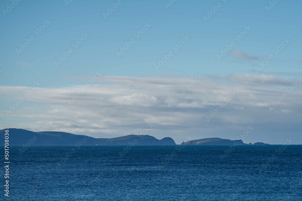 southern tasmania coastline, looking at bruny island with storm clouds and rain over the ocean